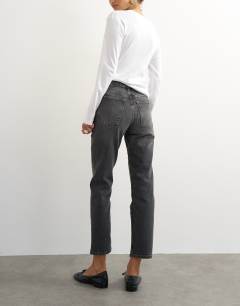 Model wearing Orson mid rise comfort straight jean in washed black