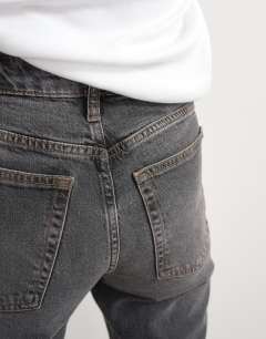 Model wearing Orson mid rise comfort straight jean in washed black