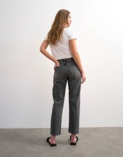 Model wearing Orson mid rise comfort straight jean in washed grey