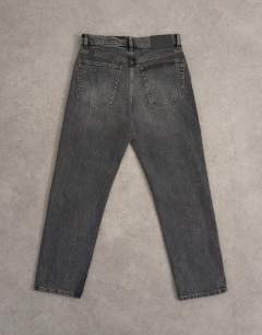Model wearing Orson mid rise comfort straight jean in washed grey