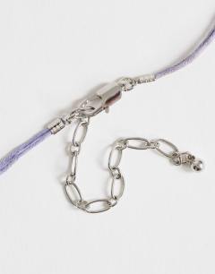 Model wearing Ottie cord necklace with semi precious stones in light blue