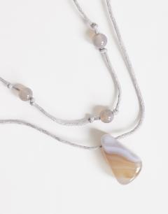 Model wearing Ottie cord necklace with semi precious stones in light grey