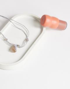 Model wearing Ottie cord necklace with semi precious stones in light grey