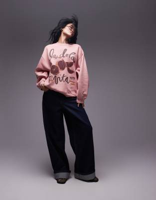 Topshop - Oversize-Sweatshirt in verwaschenem Rosa mit „la dolce vita"-Print