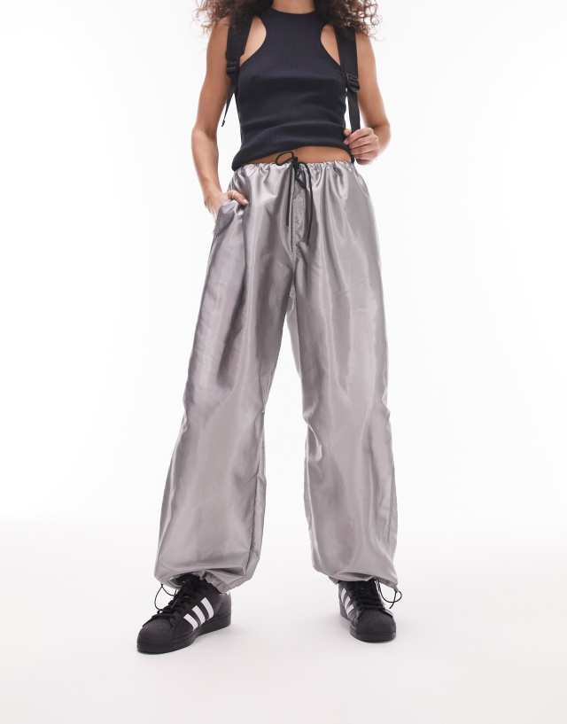 Topshop oversized balloon nylon parachute pants in metallic silver