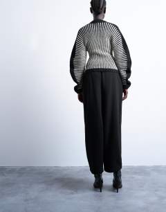 Model wearing Oversized barrel leg jogger in black