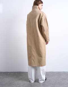 Model wearing Oversized clean funnel neck trench coat in beige