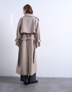 Model wearing Oversized clean tailored Trench with dropped armhole in stone