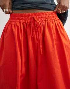 Model wearing Oversized cuff balloon trouser in red