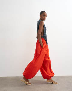 Model wearing Oversized cuff balloon trouser in red
