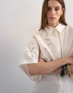 Model wearing Oversized cutwork short sleeve shirt in white