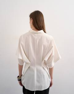 Model wearing Oversized cutwork short sleeve shirt in white