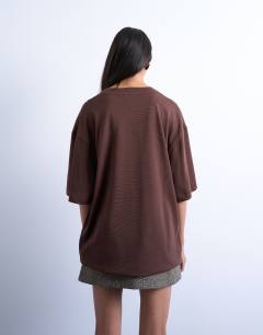Model wearing Oversized drop shoulder tee in brown
