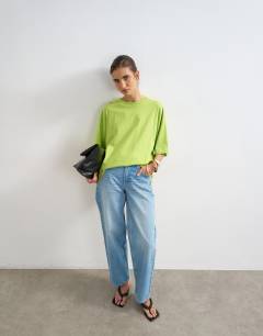 Model wearing Oversized drop shoulder tee in light green