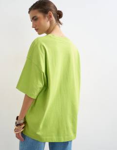 Model wearing Oversized drop shoulder tee in light green