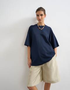 Model wearing Oversized drop shoulder tee in navy