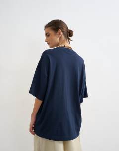 Model wearing Oversized drop shoulder tee in navy