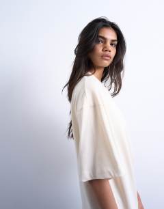 Model wearing Oversized drop shoulder tee in sand