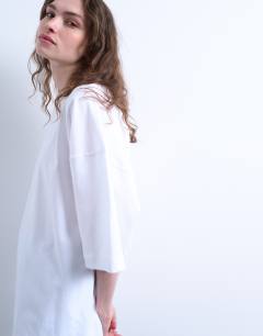 Model wearing Oversized drop shoulder tee in white