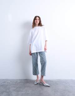 Model wearing Oversized drop shoulder tee in white