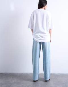 Model wearing Oversized drop shoulder tee in white