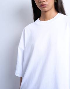 Model wearing Oversized drop shoulder tee in white
