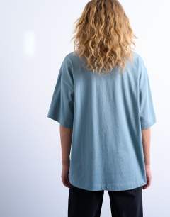 Model wearing Oversized drop shoulder tee lead blue