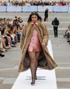 Oversized faux fur collarless long coat in natural stripe in beige