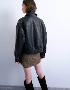 Model wearing Oversized faux leather bubble boxy zip through bomber jacket in black