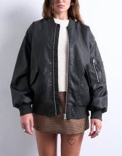 Model wearing Oversized faux leather washed MA1 bomber jacket in washed black