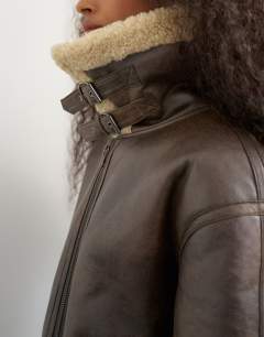 Model wearing Oversized faux shearling aviator in brown