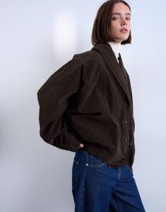 Model wearing Oversized faux suede shawl bomber jacket in chocolate
