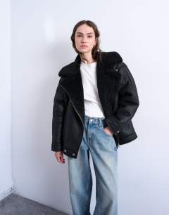 Model wearing Oversized funnel shearling aviator in black
