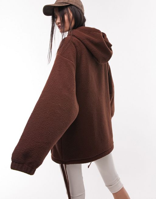 Topshop chocolate brown oversized borg fleece hoodie. Drawstring hood,
 Drop shoulders, Pouch pocket ,Drawstring hem and Oversized fit. 