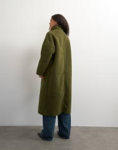 Model wearing Oversized longline borg coat in green