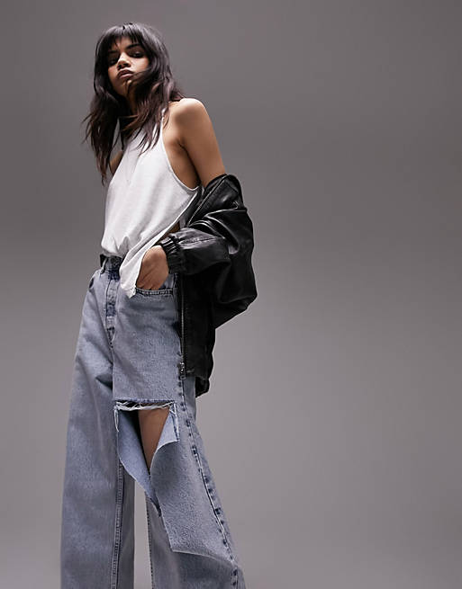 Topshop oversized mom jeans with rip in bleach