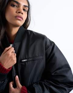 Model wearing Oversized nylon bomber jacket in black