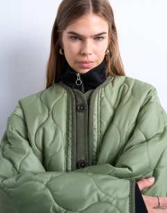 Model wearing Oversized placket two tone liner jacket in dark khaki 