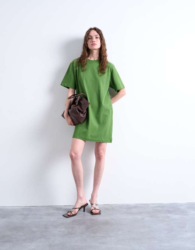 silk holiday dress A cool girl 🖤🪩 We're here for this edgy take on holiday dressing 🪞 Shop the The Sei Halter Bias Gown, Laquan Smith Mini Dress, + Siedres Franky now: https://revolve.visitlink.me/vWO3IV Meta main image 1