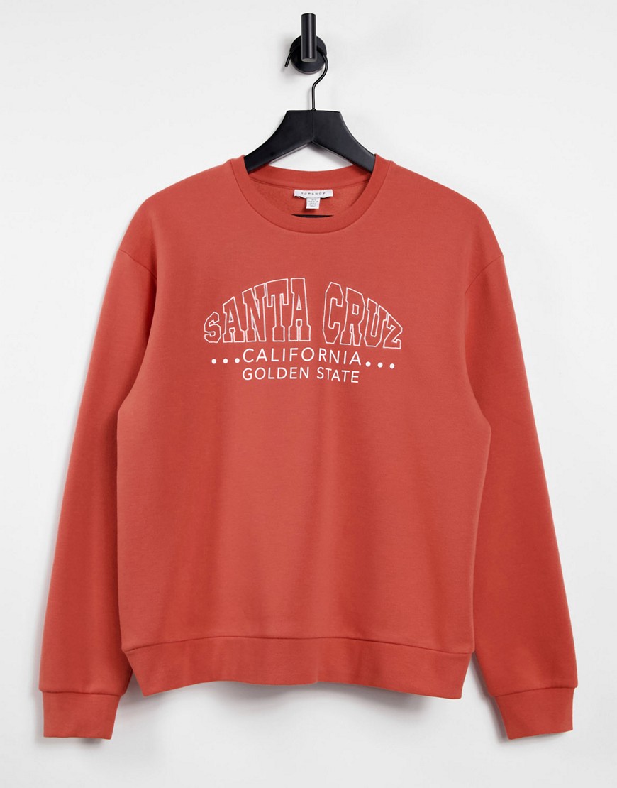 Topshop oversized 'santa cruz' sweatshirt in rust-Orange