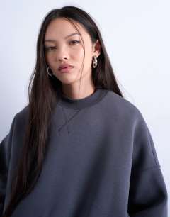 Model wearing Oversized scuba-style fabric cinch waist sweat in grey