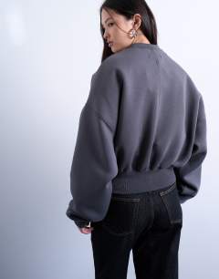 Model wearing Oversized scuba-style fabric cinch waist sweat in grey