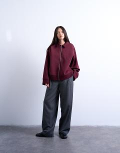 Model wearing Oversized scuba-style fabric zip through jacket in burgundy