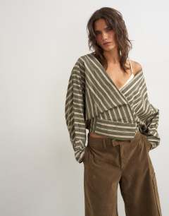 Model wearing Oversized shawl neckline wrap top in green stripe