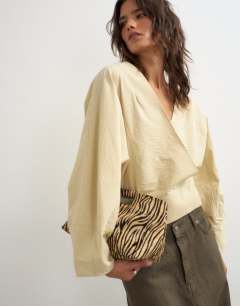 Model wearing Oversized shawl neckline wrap top in stone
