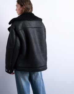 Model wearing Oversized shearling aviator in black