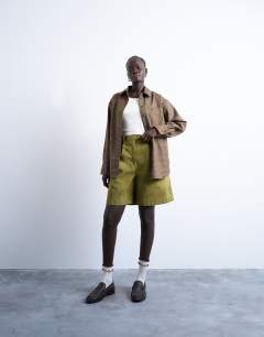 Model wearing Oversized shirt in heritage check
