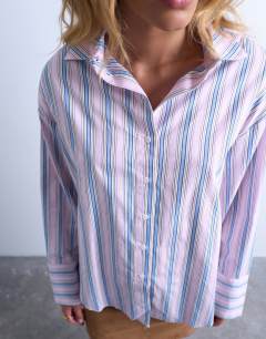 Model wearing Oversized shirt in pink & blue stripe
