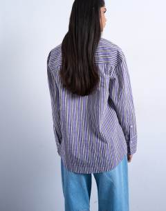 Model wearing Oversized shirt in purple stripe