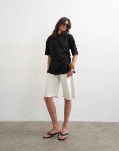 Model wearing Oversized tee with knot hem in black